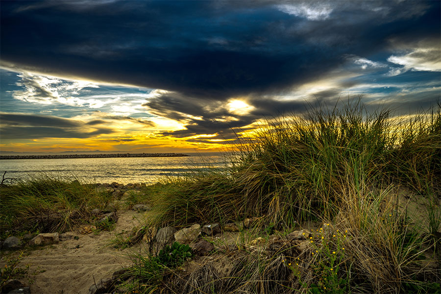 Ventura Key ocean photography with waves and glowing sunset horizon