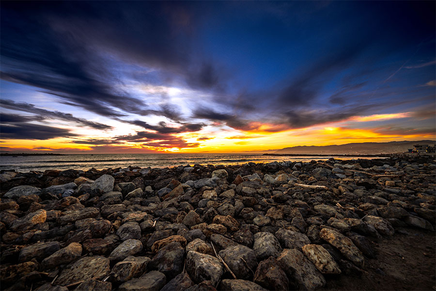 Ventura Key beach photography with rocky shoreline and sunset light